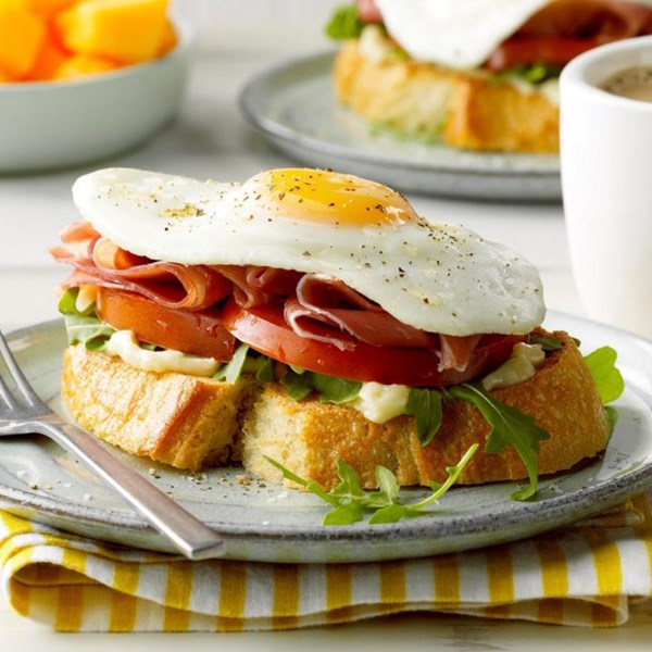 Open-faced prosciutto and egg sandwich