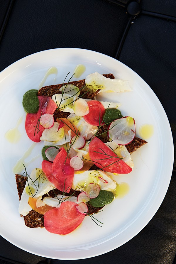 Open-faced rye, poached red snapper, pickled radish, and salsa verde sandwich