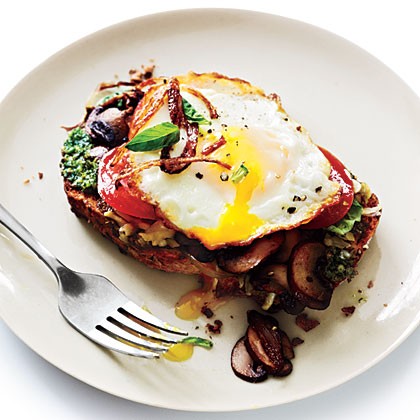Open-faced sandwiches with mushrooms and fried eggs