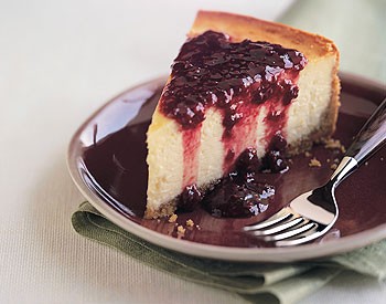 Orange blossom cheesecake with raspberry and pomegranate sauce