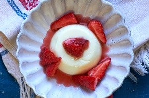 Orange blossom panna cotta with strawberries