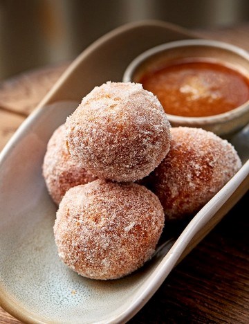 Orange brioche doughnuts with butterscotch sauce