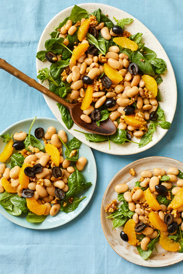 Orange, butter bean, spinach and olive salad