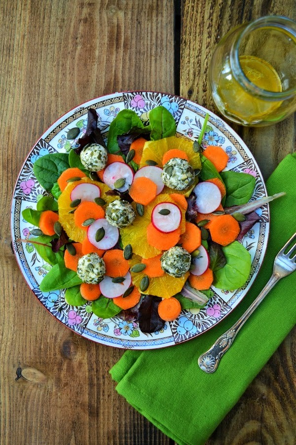 Orange, carrot and goats cheese salad with pumpkin seeds