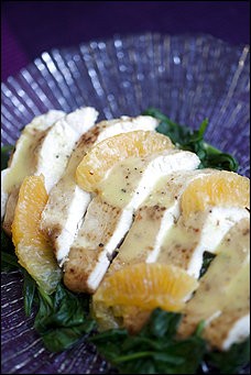 Orange chicken breasts with baby spinach