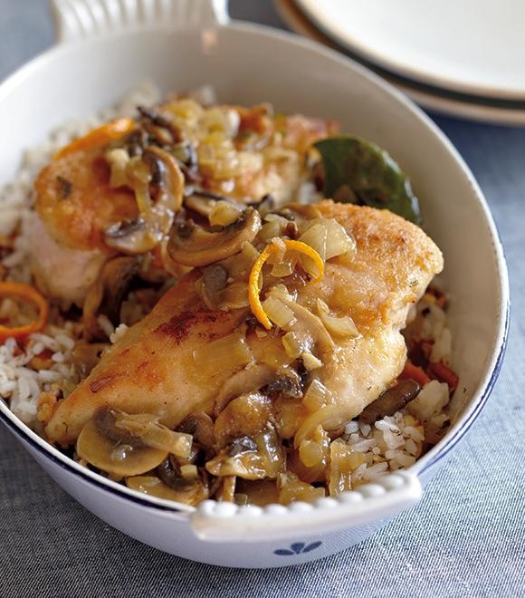 Orange chicken nested in pecan pilaf