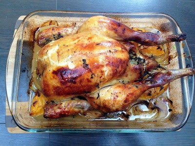 Orange, honey and lemon thyme chicken with lemon potatoes and oven roasted balsamic tomato salad