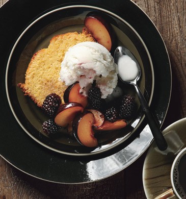 Orange polenta cake with vanilla-scented plums and blackberries and buttermilk ice cream