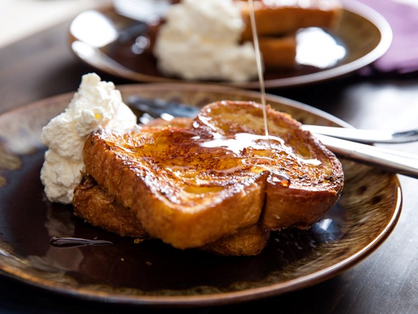Orange-rum challah French toast with whipped cream