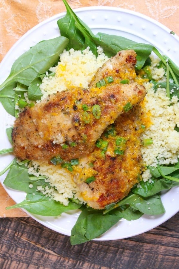 Orange scallion chicken with spinach and couscous