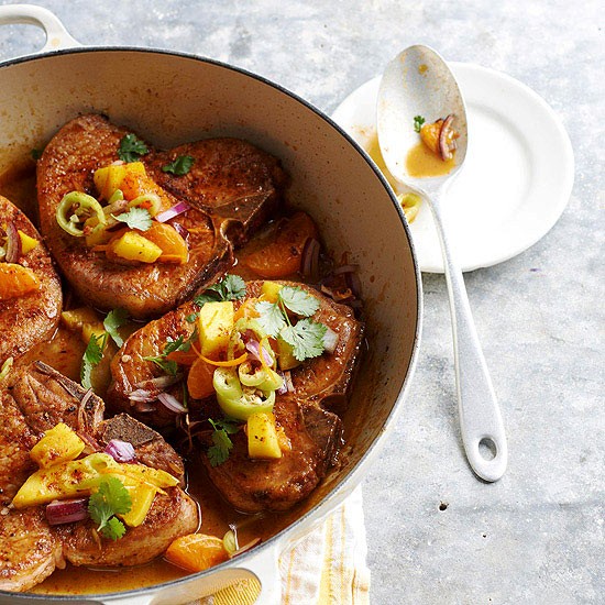 Orange-simmered pork chops with mango relish