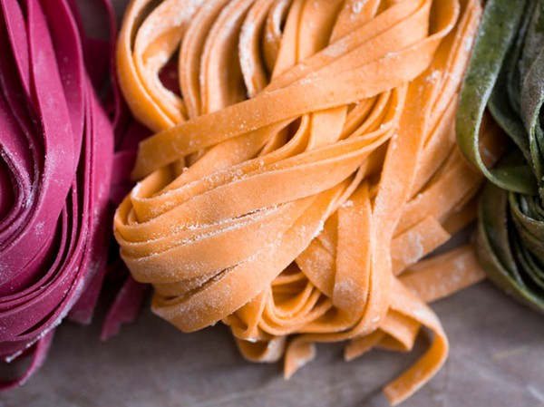 Orange tomato paste-colored fresh pasta