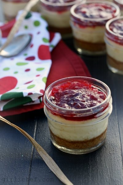 Orange white chocolate cheesecakes with cranberry sauce