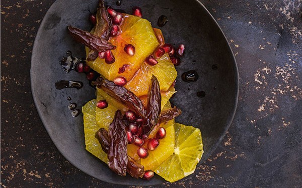 Oranges, dates and pomegranates in spiced syrup