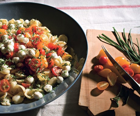 Orecchiette with fresh mozzarella, grape tomatoes, and garlic chives