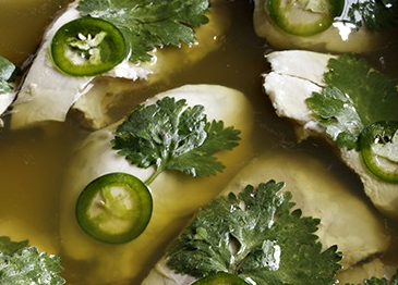 Oriental poached chicken in green chilli and coriander jelly