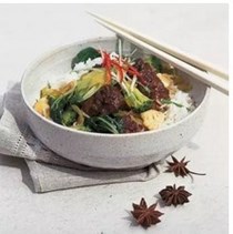 Oriental pork casserole with stir-fried green vegetables