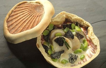 Orkney scallops baked in the shell with morels and broad beans