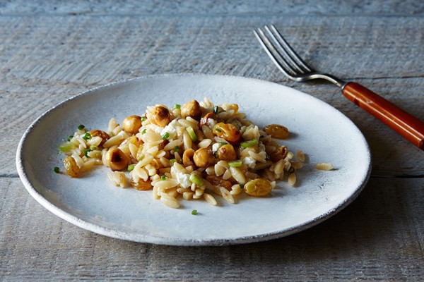 Orzo salad with scallions, hazelnuts, and golden raisins