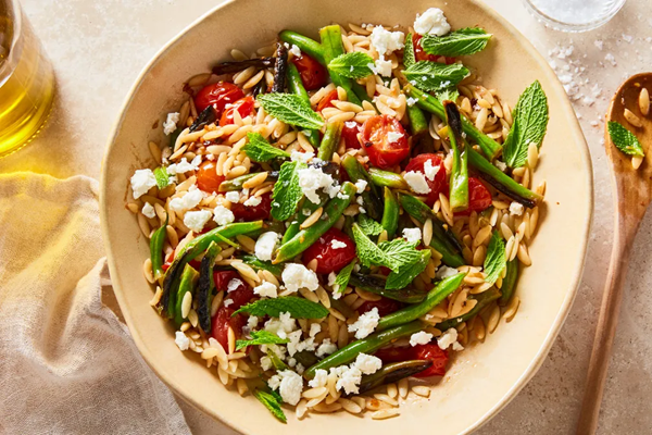Orzo with blistered green beans, burst tomatoes & feta