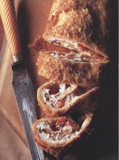 Oven-baked pancake rolled with goats’ cheese, tomatoes and basil