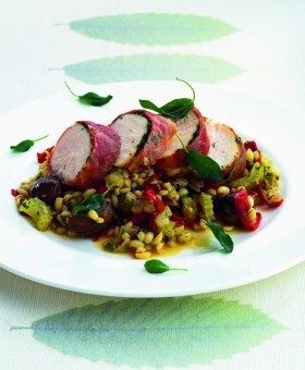 Oven-baked pilaf of barley, chestnuts and celery with chicken wrapped in ham