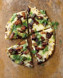 Oven-baked pizza with double-smoked bacon, caramelized onions, toasted garlic