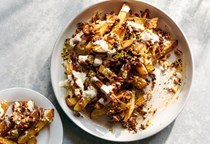 Oven fries with tahini yogurt and smoky-sweet nuts