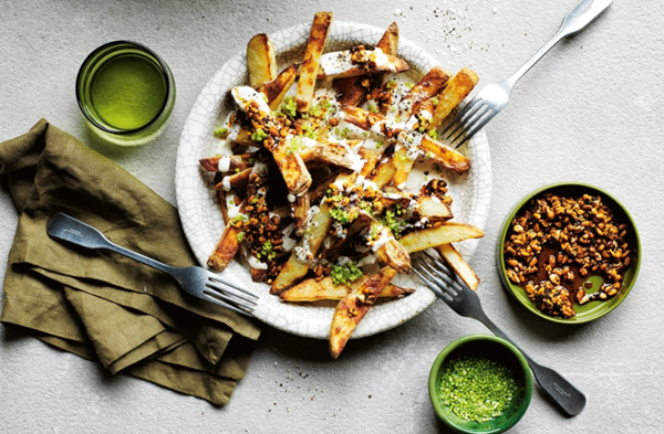 Oven fries with tahini yogurt and smoky-sweet nuts