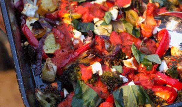 Oven-roasted vegetables with crumbled goats' cheese, thyme and parsley