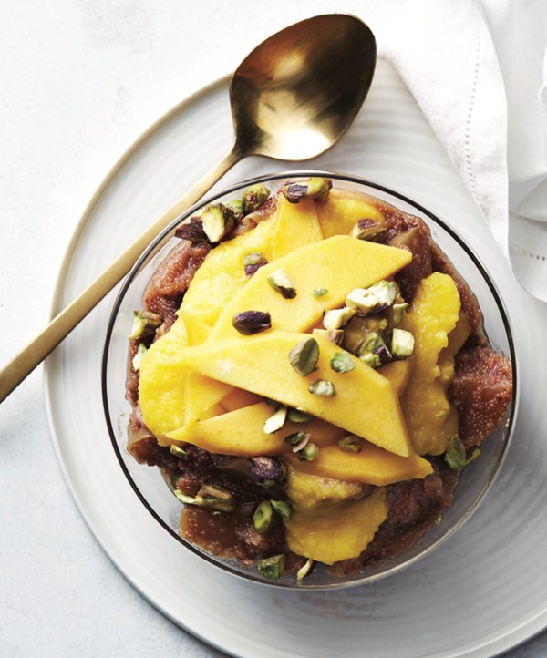 Overnight amaranth porridge with mango puree and pistachios
