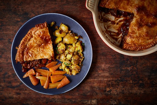 Ox cheek and stout pie with crushed new potatoes and glazed baby carrots
