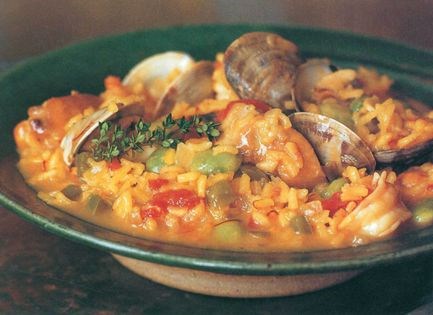 Paella with chicken, clams, and shrimp