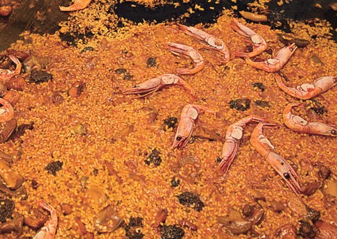 Paella with chicken, mushrooms, and shrimp