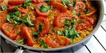 Paella with tomatoes