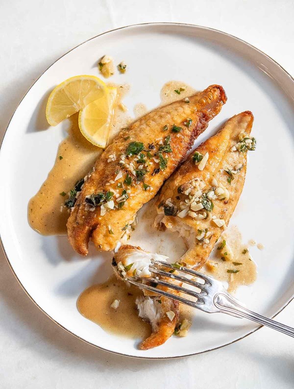 Pan-fried bass with lemon garlic herb sauce