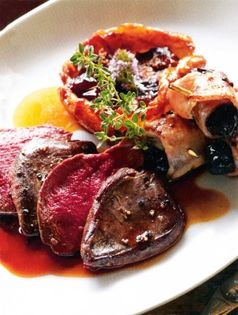 Pan-fried breasts of local wood pigeon, caramelised home-grown fig Tatin, prune and bacon rolls and spiced juices