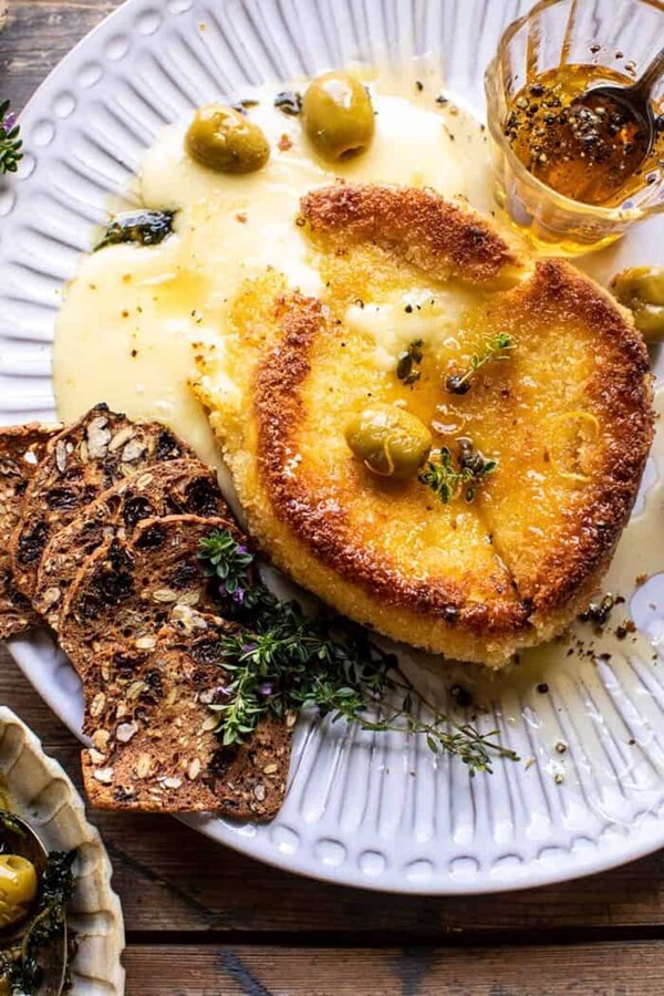 Pan fried Brie with peppered honey and olives