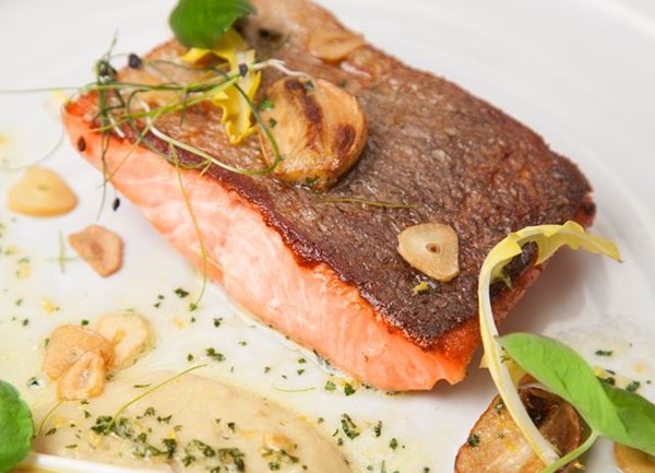 Pan-fried fjord trout with white bean purée and garlic crisps