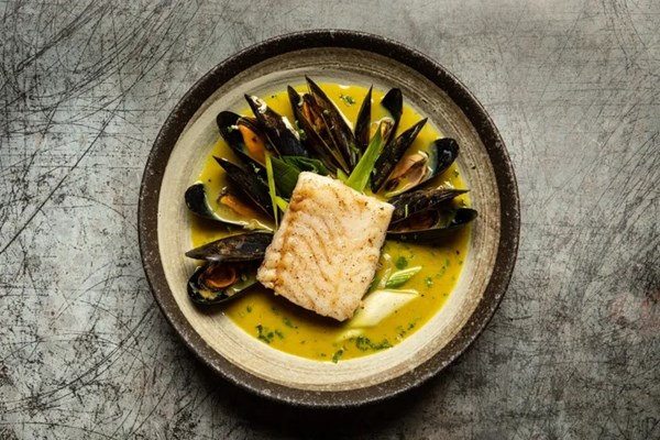 Pan-fried hake with curried mussels