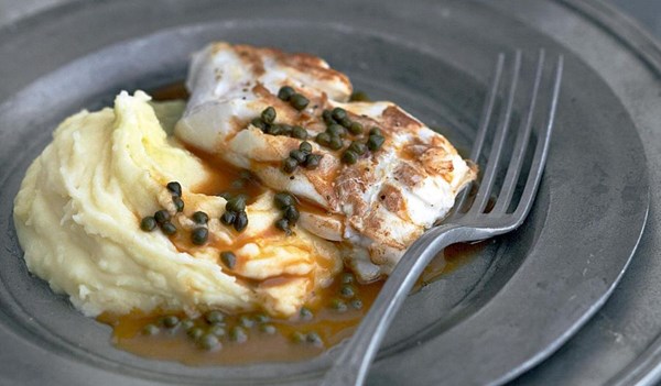 Pan-fried pollock fillet on a purée of potatoes with a caper sauce