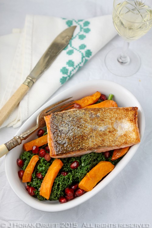 Pan-fried salmon on kale, sweet potato and pomegranate