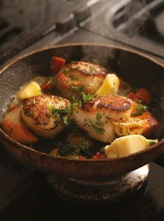 Pan-fried scallops with herb butter and crispy chorizo