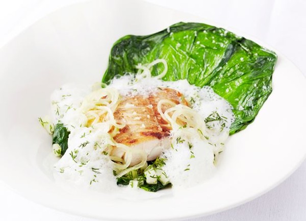 Pan-fried sea bass fillet and mousseline raviolo, steamed lettuce and cucumber