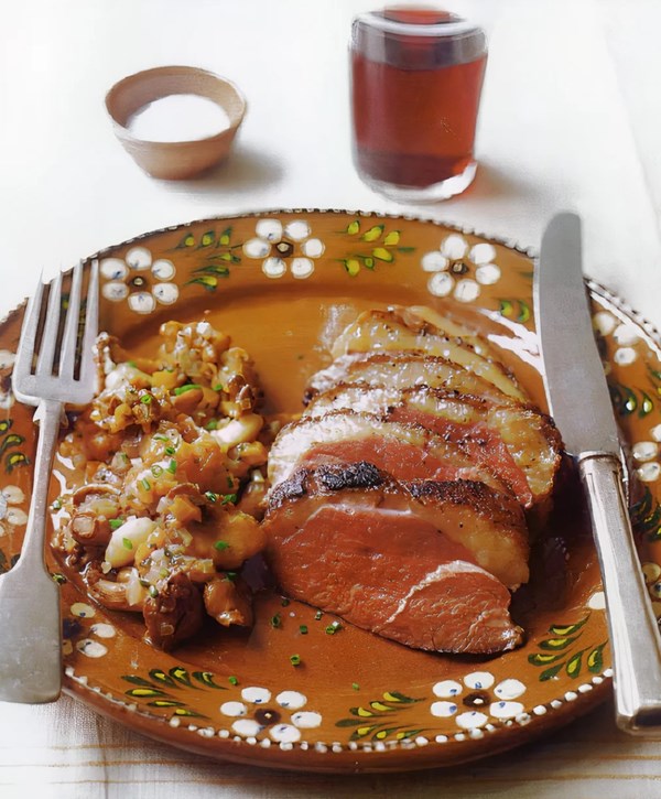 Pan-grilled duck breast with chanterelles, dried apricots, and almonds