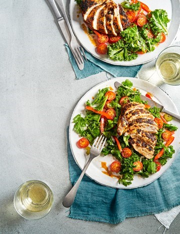 Pan-roast Cajun chicken supremes with kale salad and honey-mustard dressing