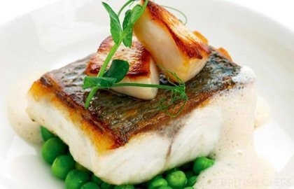 Pan-roast sea bass fillet with Jersey scallops & garden peas