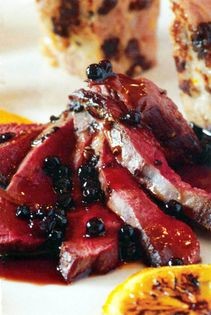 Pan-roast wild duck with citrus forcement, poached elder berries, spiced carrot purée and traditional Yorkshire sauce