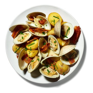 Pan-roasted clams with potatoes, bacon, and cream