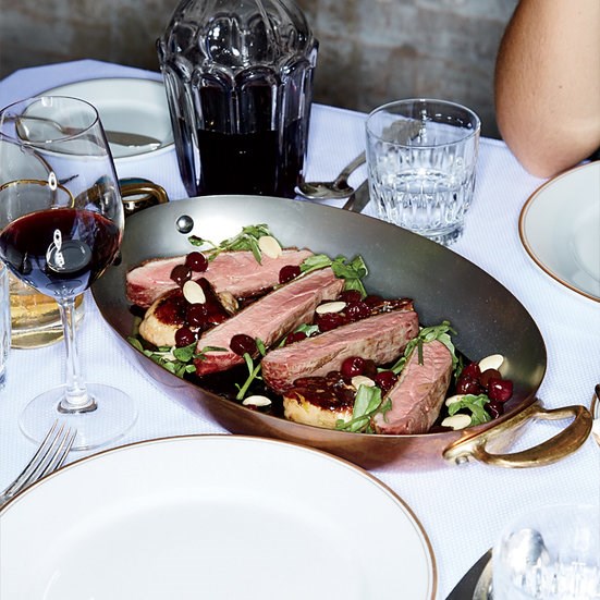 Pan-roasted duck with cherries and olives